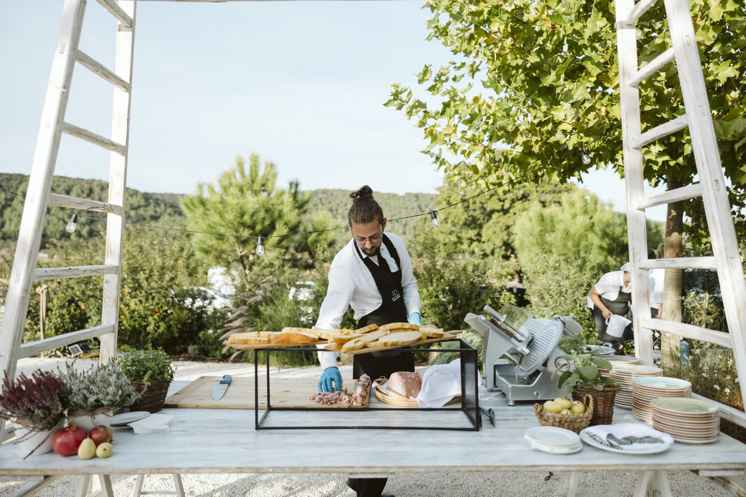 Catered bread and food station at a Pistola wedding
