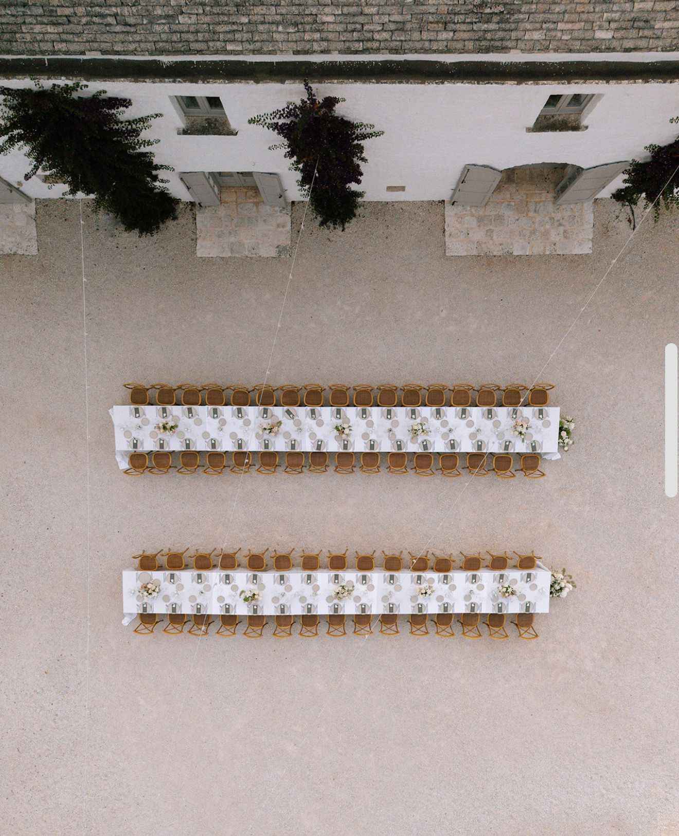 Overhead view of two wedding tables in the Masseria courtyard